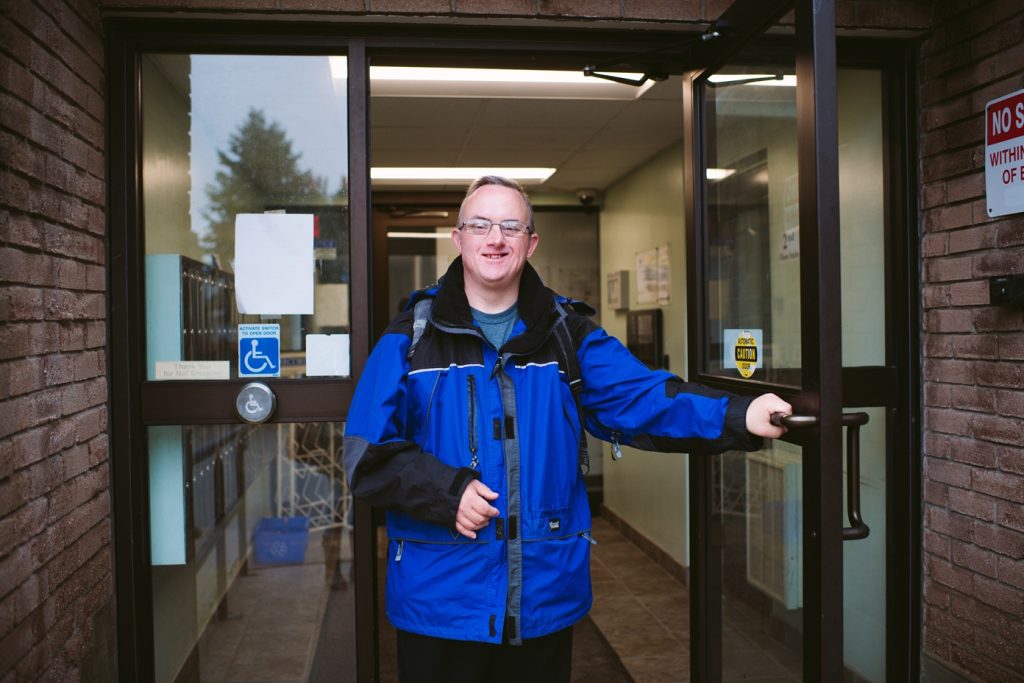 Key differences among the current and emerging Alzheimer’s clinical trials in Down syndrome 1 Man smiling as he leaves his apartment building